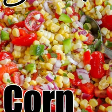 Delicious summer corn salad with fresh vegetables and herbs in a bowl.