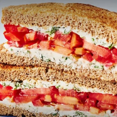 Delicious classic tomato sandwich with fresh ingredients on a plate
