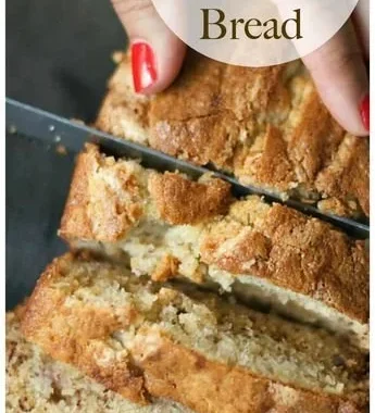 Deliciously moist sour cream banana bread sliced on a wooden board
