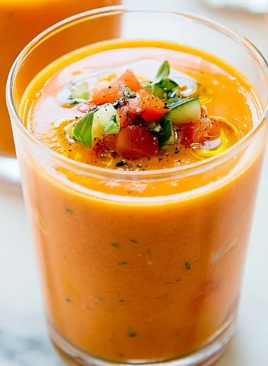 Bowl of refreshing homemade gazpacho with fresh vegetables and herbs