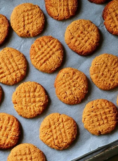 Gluten free and dairy free peanut butter cookies on a wooden plate