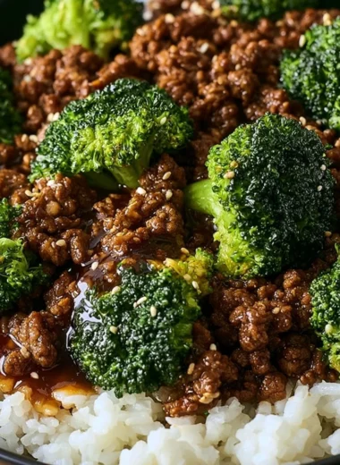 Delicious ground beef and broccoli dish on a plate, garnished with sesame seeds.