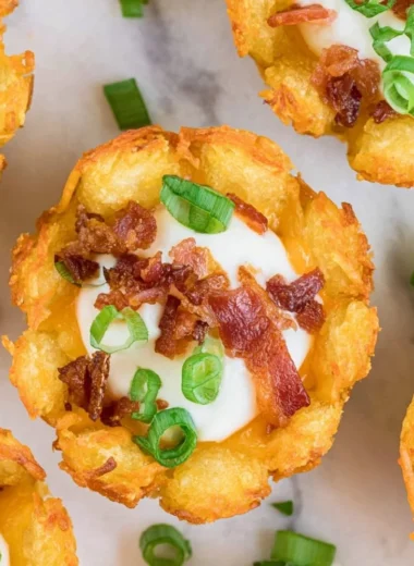 Loaded Tater Tot Appetizer topped with cheese and savory toppings