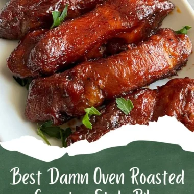 Oven-roasted country-style pork ribs garnished with herbs.