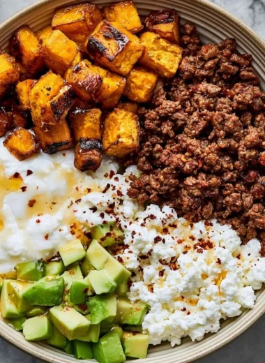 High-protein cottage cheese taco bowl with fresh toppings and ingredients.
