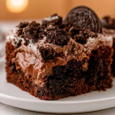 Delicious and cozy dirt cake served in a rustic pot with chocolate and cream layers.