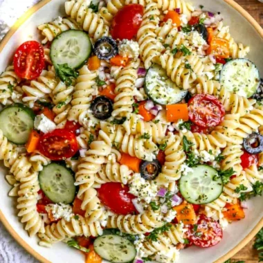 Colorful pasta salad with fresh vegetables for summer days