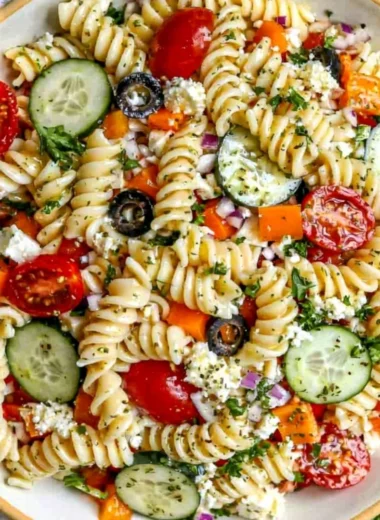 Colorful pasta salad with fresh vegetables for summer days