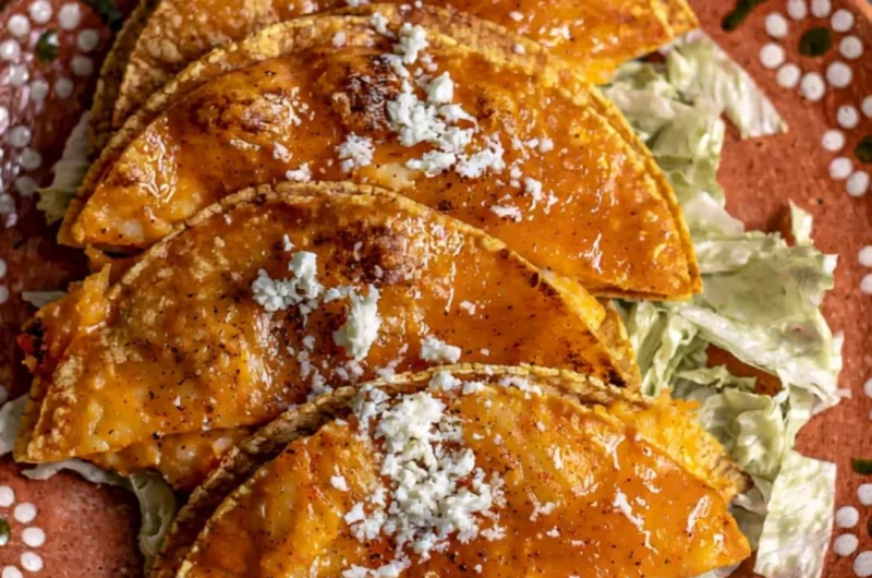 Plate of authentic potato tacos topped with fresh ingredients
