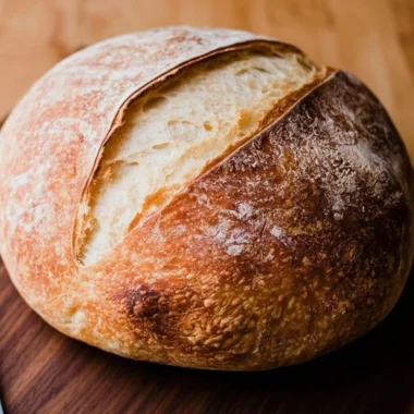 Homemade sourdough bread loaf fresh out of the oven.