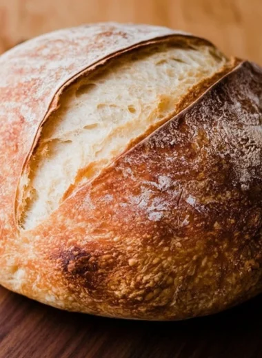 Homemade sourdough bread loaf fresh out of the oven.