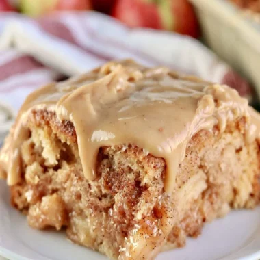 Deliciously moist Apple Dapple Cake topped with cinnamon and nuts.