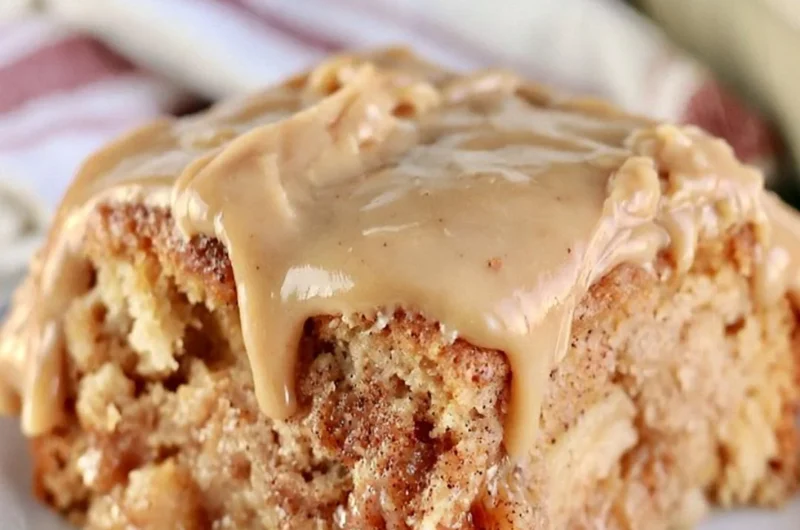 Deliciously moist Apple Dapple Cake topped with cinnamon and nuts.