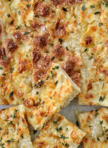 Cozy Gruyère and thyme Italian focaccia bread, fresh out of the oven.