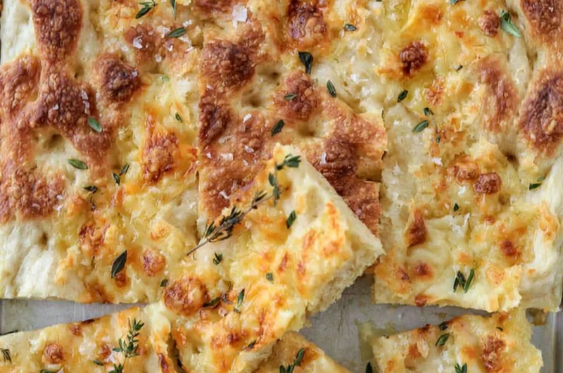 Cozy Gruyère and thyme Italian focaccia bread, fresh out of the oven.