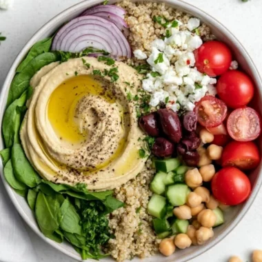 Delicious cozy Mediterranean hummus bowl with fresh vegetables and pita