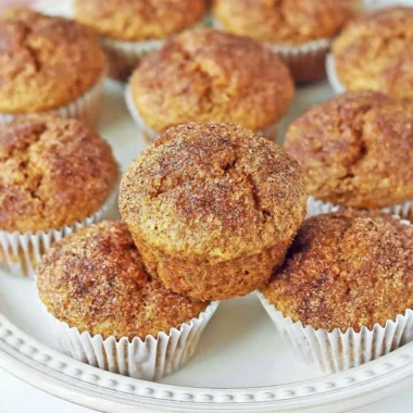 Freshly baked cozy pumpkin muffins ideal for autumn evenings