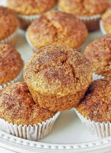 Freshly baked cozy pumpkin muffins ideal for autumn evenings