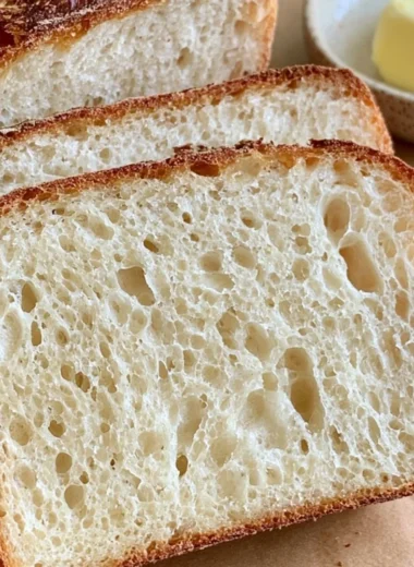 Delicious homemade sourdough sandwich loaf fresh out of the oven.