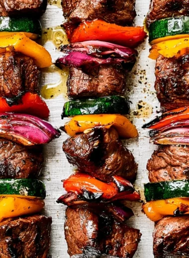 Cozy steak kabobs recipe featuring grilled steak and fresh vegetables on skewers.
