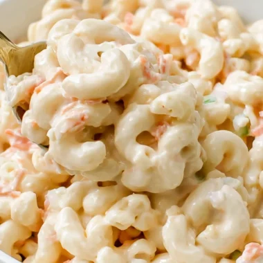 Bowl of creamy Ono Hawaiian BBQ macaroni salad with vegetables.