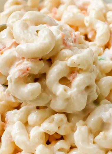 Bowl of creamy Ono Hawaiian BBQ macaroni salad with vegetables.