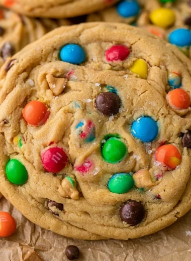 Freshly baked Peanut Butter M&M Cookies on a cooling rack