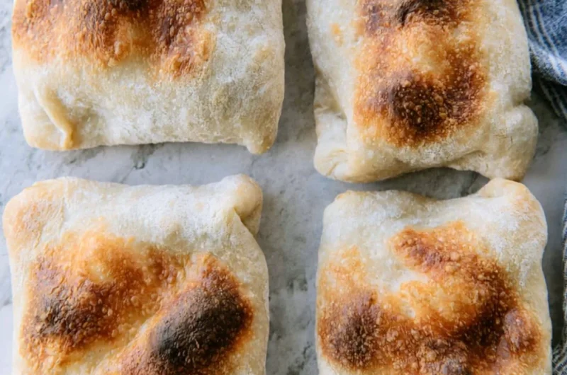 Freshly baked sourdough ciabatta bread with a crusty exterior and airy texture