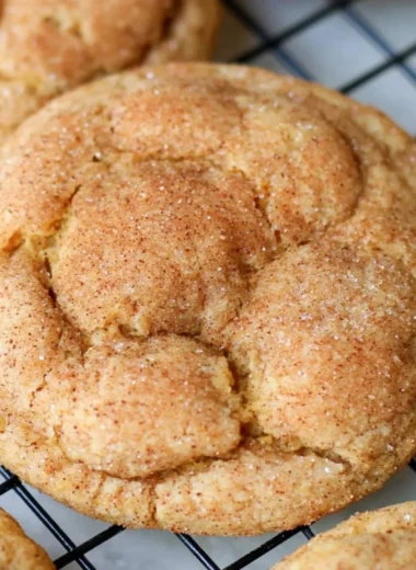 Delicious easy pumpkin snickerdoodle cookies on a rustic table