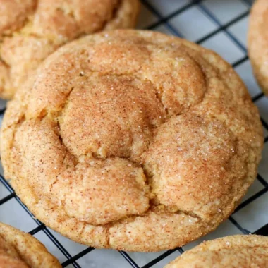 Delicious pumpkin snickerdoodle cookies on a baking tray.