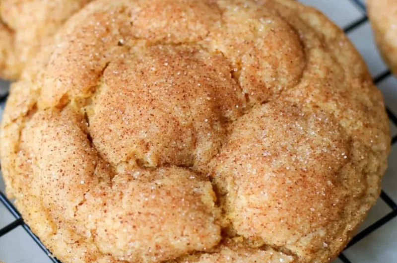 Delicious pumpkin snickerdoodle cookies on a baking tray.