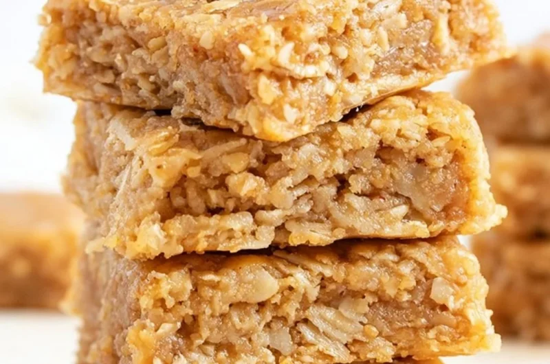 Delicious soft and chewy apple oatmeal bars on a wooden table
