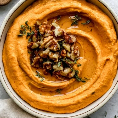 Creamy Pumpkin Feta Dip served in a bowl with crackers