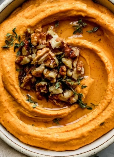 Creamy Pumpkin Feta Dip served in a bowl with crackers